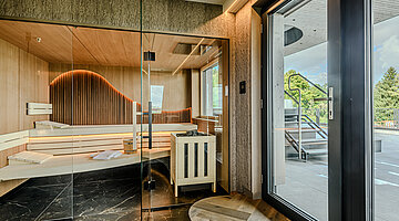 Sauna in the Wolke 7 Private Spa Private sauna in the Wolke 7 at Hotel Winzer with spacious timber benches, sauna heater and access to the terrace
