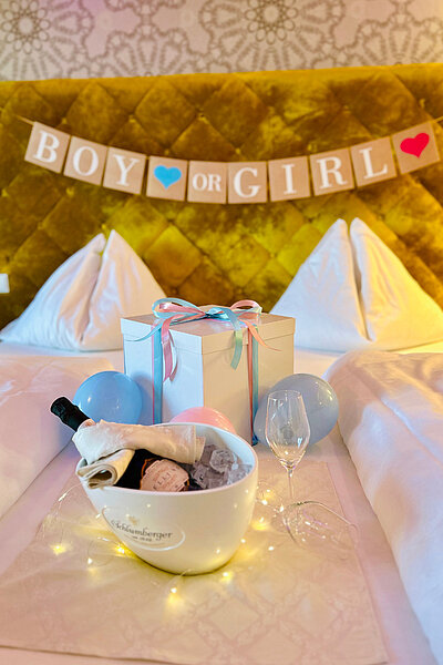 A gender reveal display on a bed at the Hotel Winzer