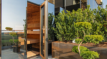 The sunny terrace of the Private Spa Villa at the Hotel Winzer in Austria