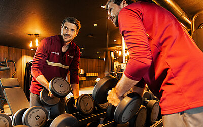 Guests working out in the fitness area at Hotel Winzer