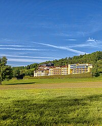 Exterior view of the Hotel Winzer on a sunny day