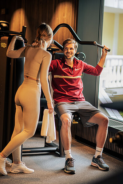 Guests working out in the fitness area at Hotel Winzer