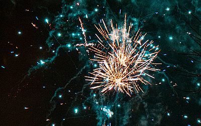 A colourful display of fireworks in the night sky