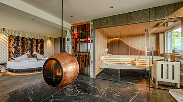 Private Sauna in the Wolke 7 Private spa in the Wolke 7 at Hotel Winzer with a spacious sauna, design fireplace and open connection to the sleeping area