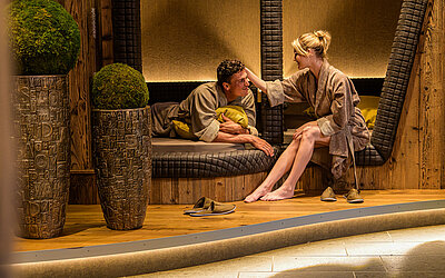 A couple relaxing in the relaxation room at the Emotion Spa in the Hotel Winzer