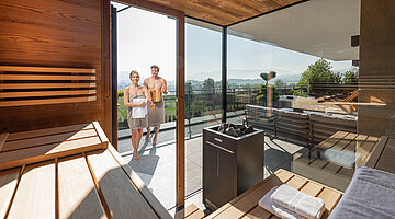 A couple in the Private Spa Villa’s private sauna at the Hotel Winzer