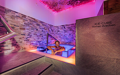 A man in the nude in the Ice Cube plunge pool at the Sole Spa in the Hotel Winzer