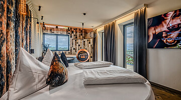 Private Cinema Suite with Round Bed and Design Fireplace Private Cinema Suite at Hotel Winzer with a round double bed, distinctive design fireplace and stylish living area for two