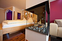 Cosy fireplace in the 'Kuscheltraum' Junior Suite at Hotel Winzer