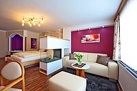 Zirbentraum Junior Suite with a hot tub and fireplace at Hotel Winzer