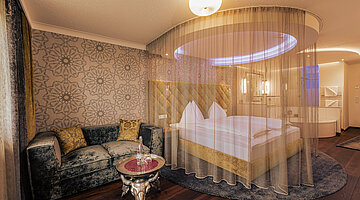 Emotion Double Room with a cosy bed at the Romantik-Wellnesshotel Winzer