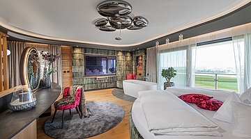 Bedroom with a freestanding bath in the Private Spa Villa at the Hotel Winzer